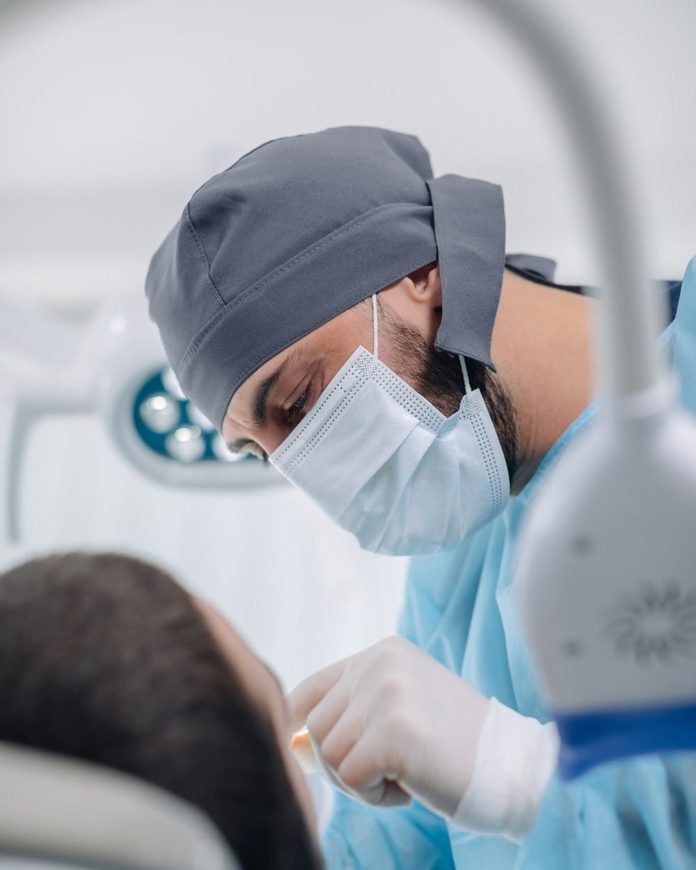 Dr. Zurab Kipshidze, practising dentist and Zura's clinical ambassador, treating a patient